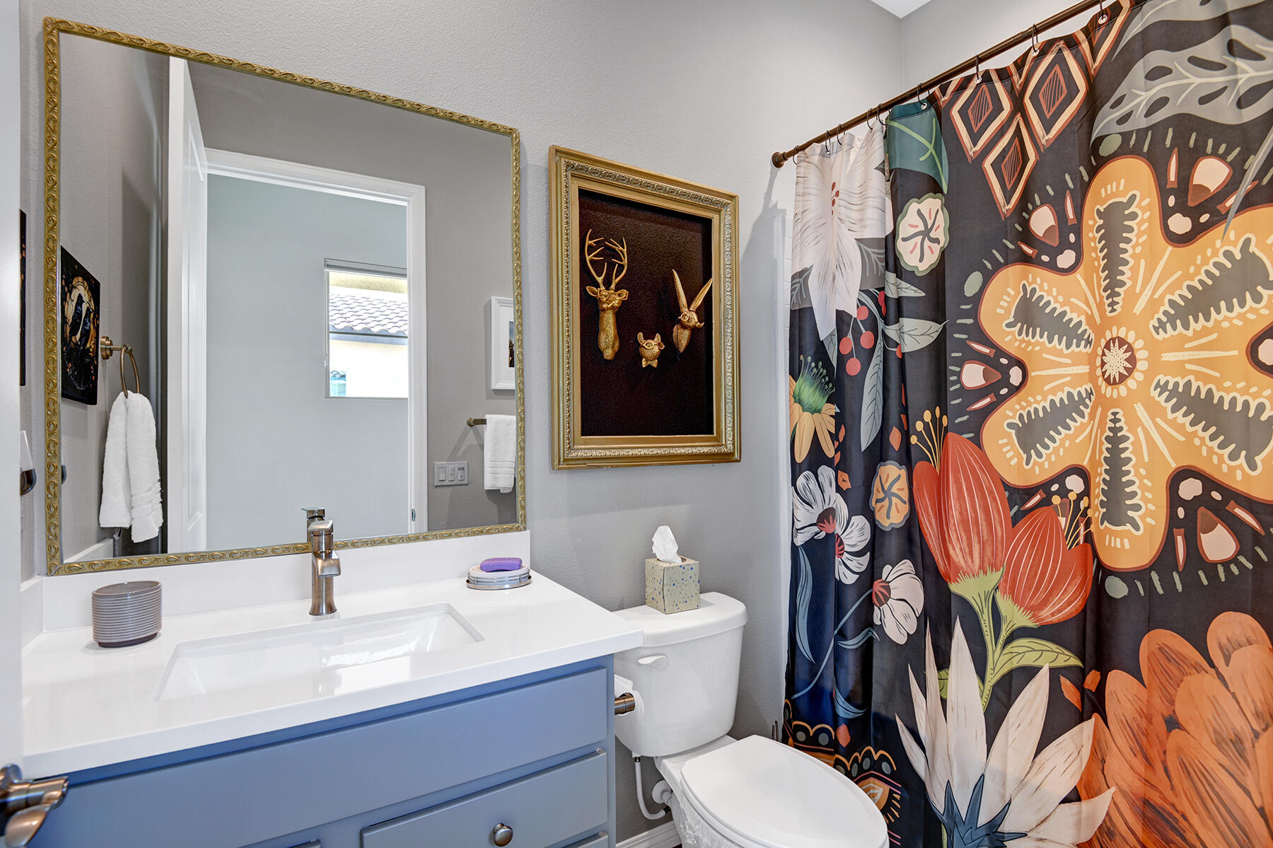 58 Claret Road Rancho Mirage, CA 92270 - Photo 14 of 33 a bathroom with a toilet sink and mirror