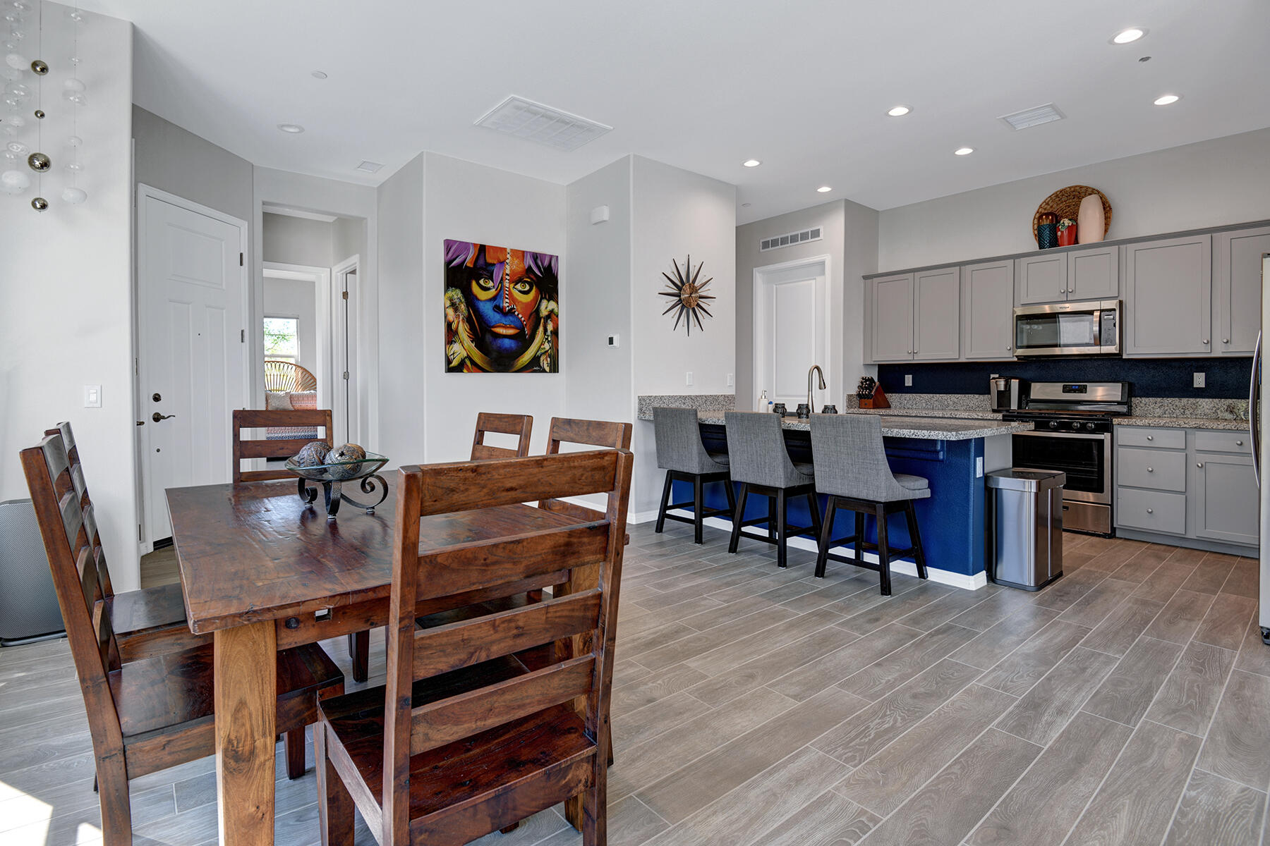 58 Claret Road Rancho Mirage, CA 92270 - Photo 15 of 33 a view of a dining room with furniture and wooden floor