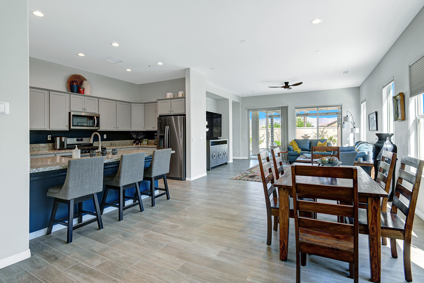 58 Claret Road Rancho Mirage, CA 92270 - Photo 16 of 33 a view of a dining room with furniture and wooden floor
