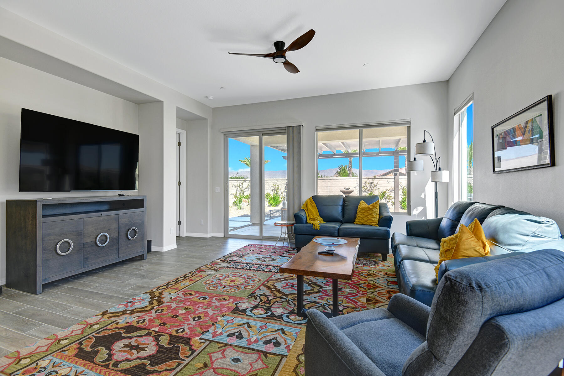 58 Claret Road Rancho Mirage, CA 92270 - Photo 17 of 33 a living room with furniture and a flat screen tv