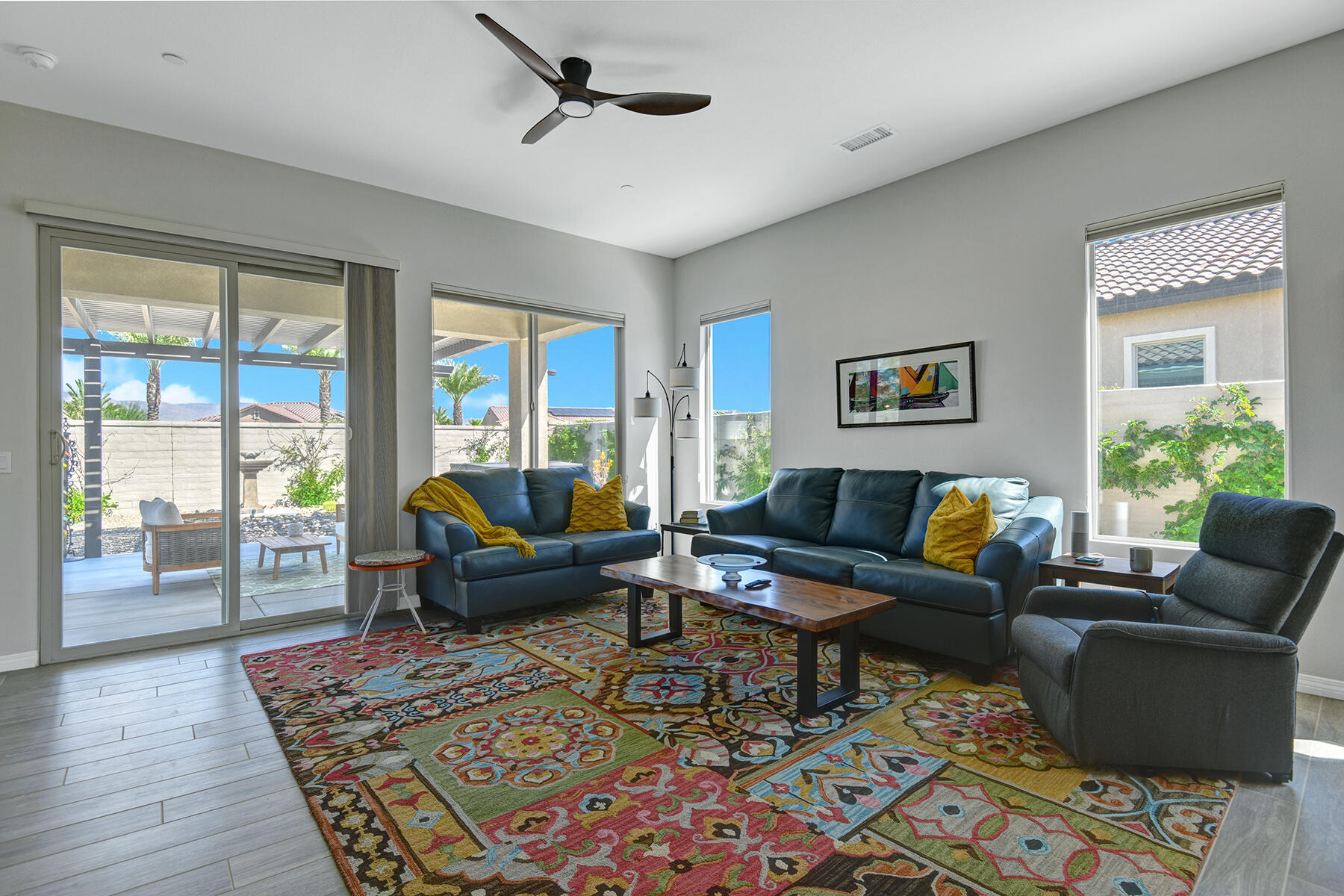 58 Claret Road Rancho Mirage, CA 92270 - Photo 18 of 33 a living room with furniture wooden floor and a rug