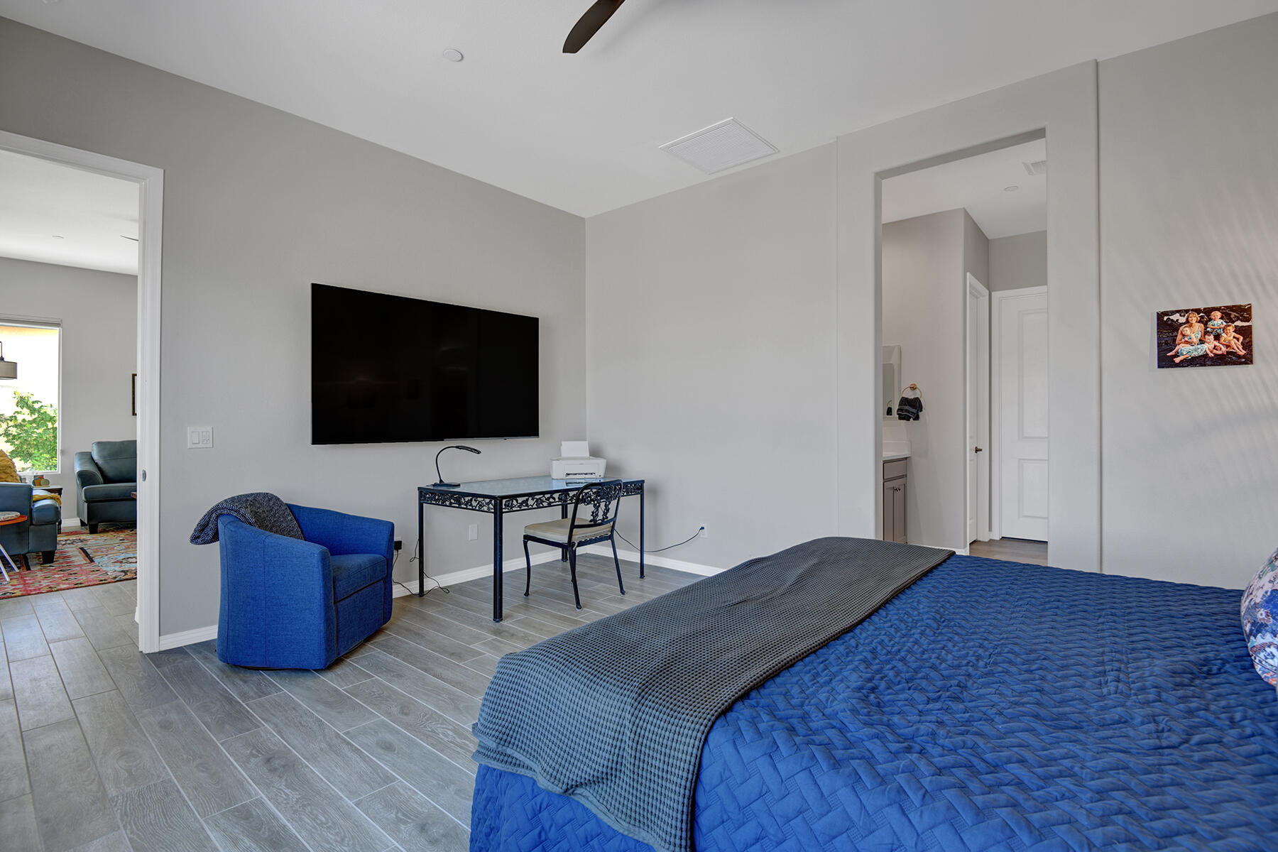 58 Claret Road Rancho Mirage, CA 92270 - Photo 25 of 33 a bedroom with a bed and a flat screen tv