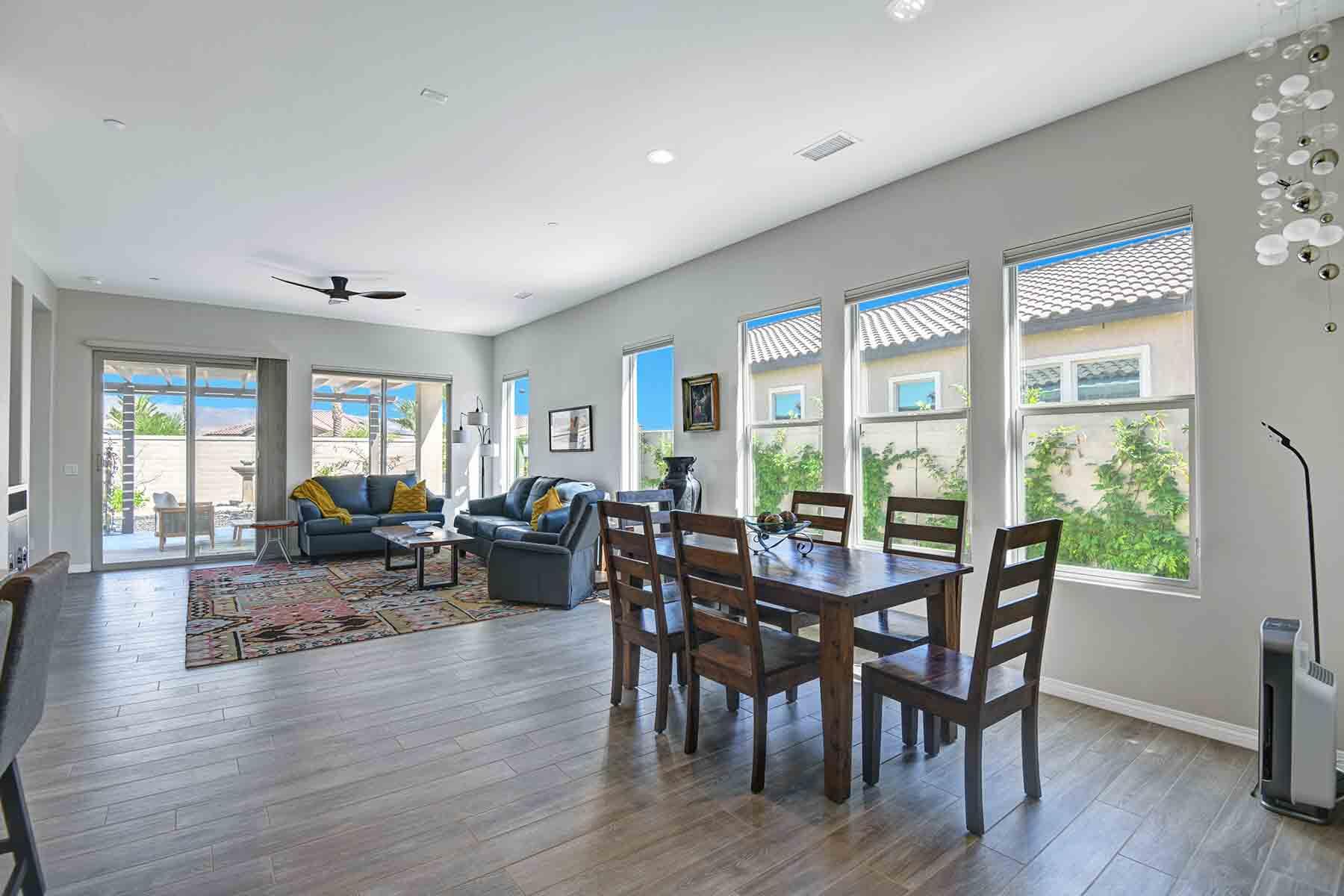 58 Claret Road Rancho Mirage, CA 92270 - Photo 9 of 33 a view of a dining room with furniture window and wooden floor