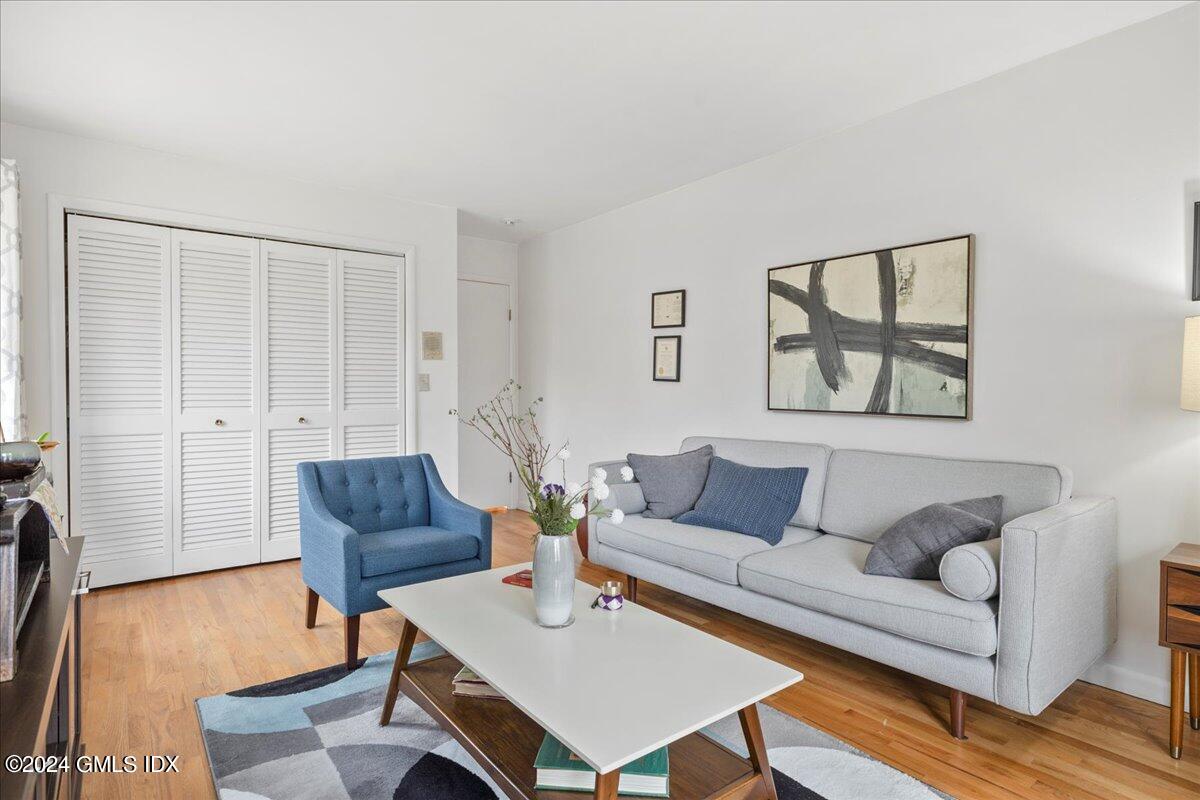 693 Den Road Stamford, CT 06903 - Photo 16 of 32 a living room with furniture and a wooden floor