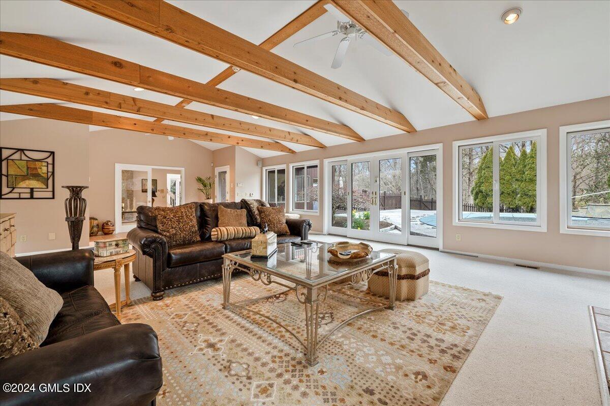 693 Den Road Stamford, CT 06903 - Photo 4 of 32 a living room with furniture and a large window