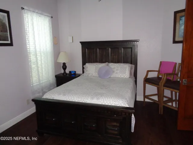 a bedroom with a bed and a table in it