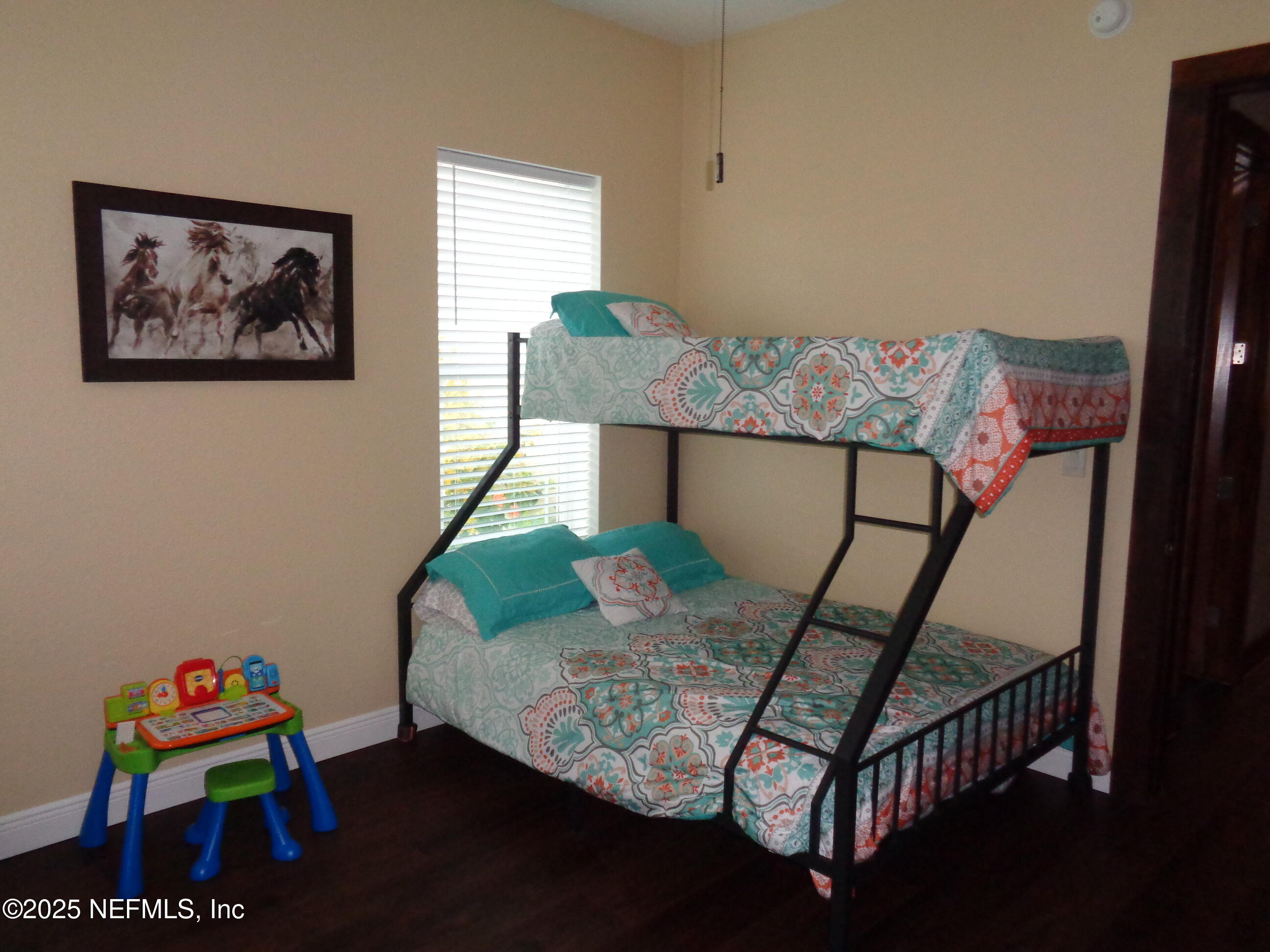 8995 Barrel Factory Road Hastings, FL 32145 - Photo 12 of 23 a bedroom with furniture and a window