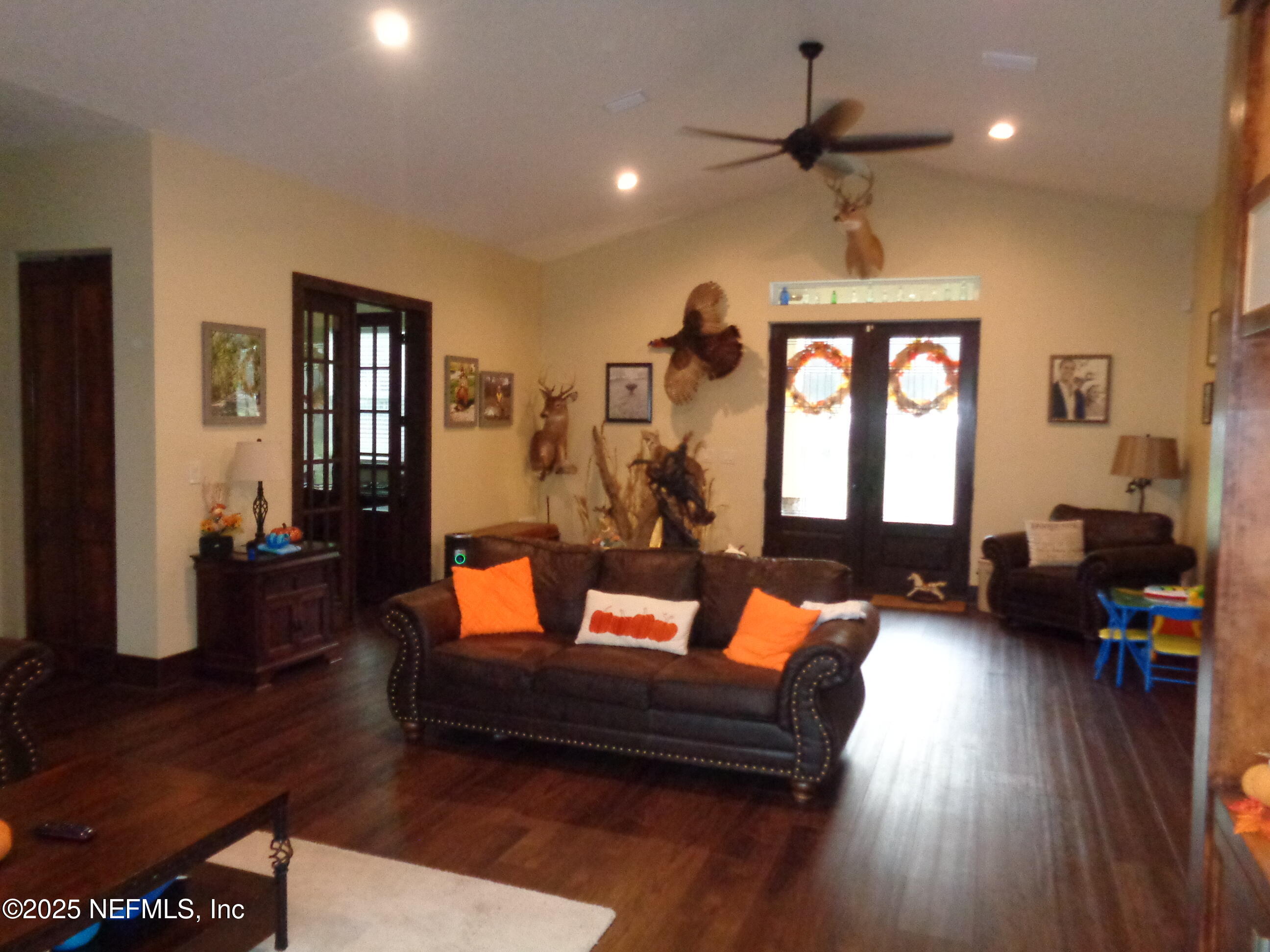 8995 Barrel Factory Road Hastings, FL 32145 - Photo 18 of 23 a living room with furniture and a wooden floor