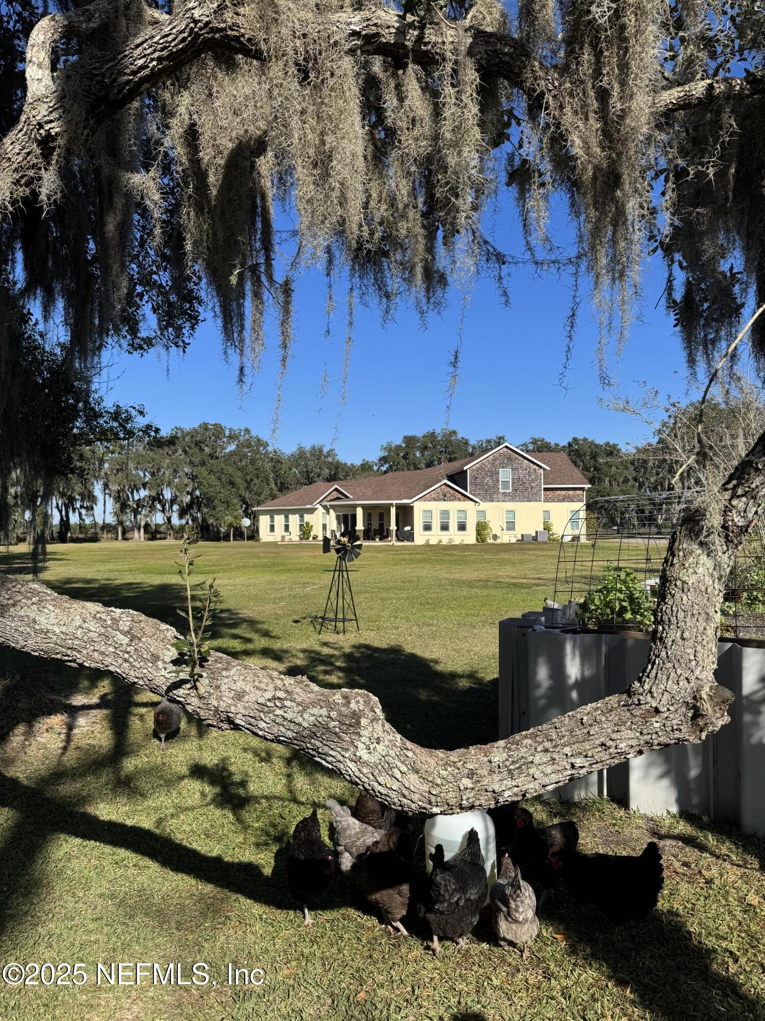 8995 Barrel Factory Road Hastings, FL 32145 - Photo 23 of 23 a view of a lake with a yard