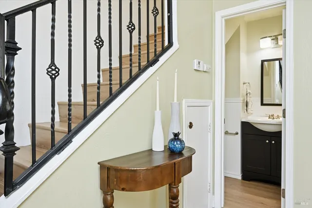 a bathroom with a sink and a mirror with toilet