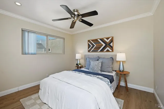 a view of backyard with a barn and large trees