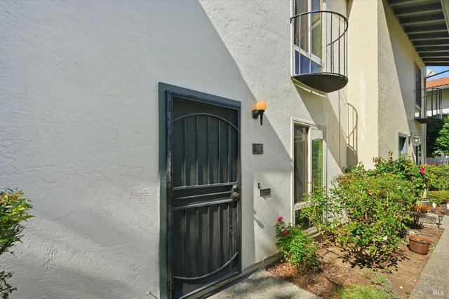 a view of swimming pool with a bench and trees