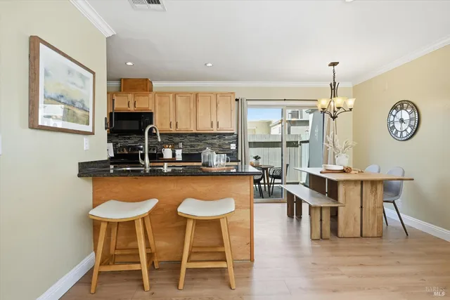 a dining table with chairs and wooden floor