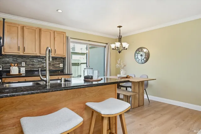 a very nice looking dining room with a table and chairs