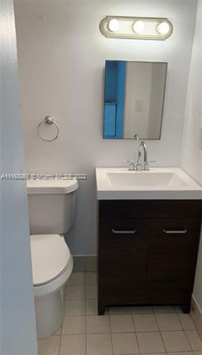 Tamiami Miami, FL 33175 - Photo 6 of 6 a bathroom with a toilet sink and mirror