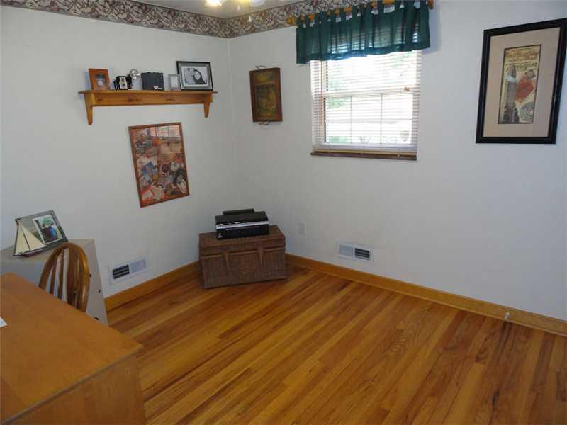 1937 Bower Hill Road Pittsburgh, PA 15243 - Photo 14 of 24 Bedroom. he first floor den or bedroom is 10 x 9 and is light and bright. The hard wood floors are lovely and there is neutral paint, a ceiling fan, and a roomy closet for the home owners delight!