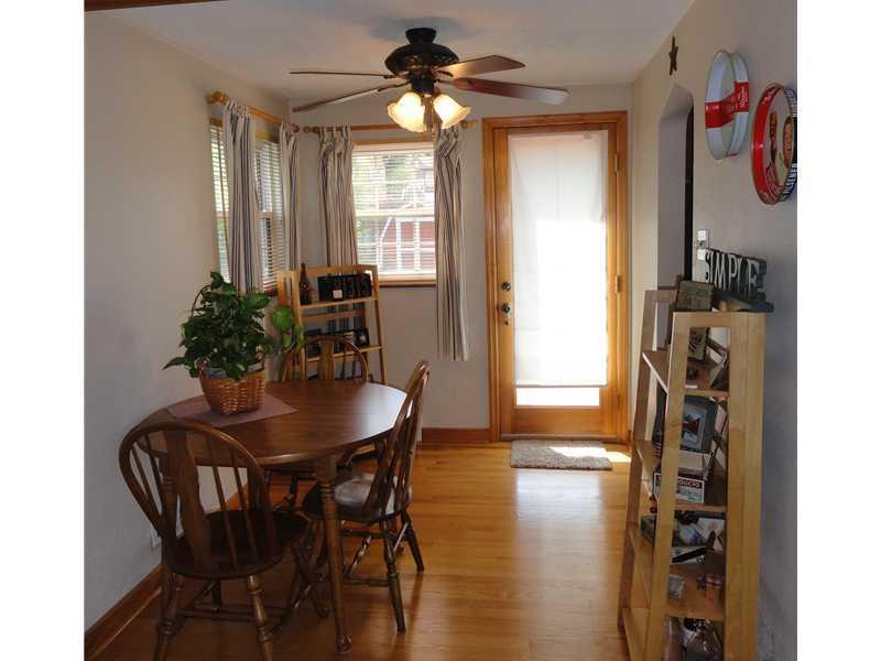 1937 Bower Hill Road Pittsburgh, PA 15243 - Photo 7 of 24 Dining Room. The 10 x 8 dining room area is adjacent to the living room, kitchen and out door back deck. The dining room has gleaming hardwood floors, neutral paint and the window treatments are staying with this home.