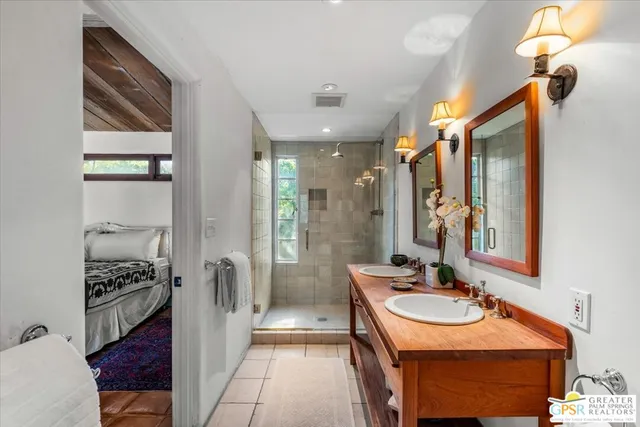 a bathroom with a sink double vanity and a bathtub