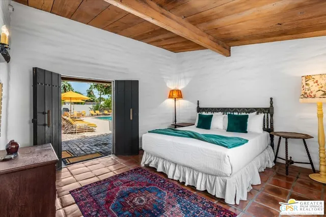 a bedroom with double bed and a window