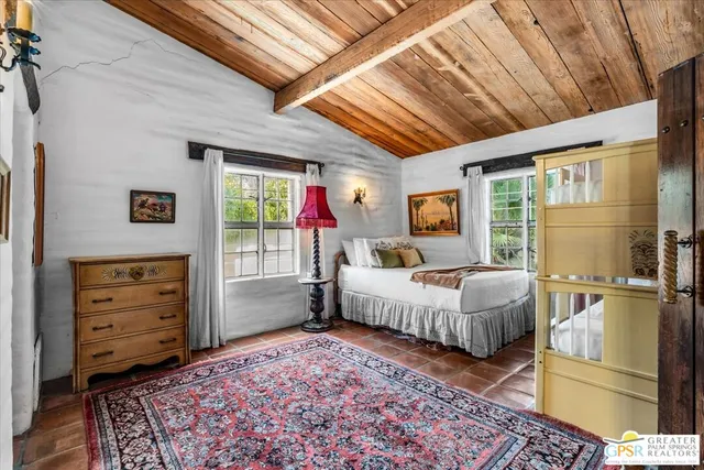 a bed room with a bed and a window