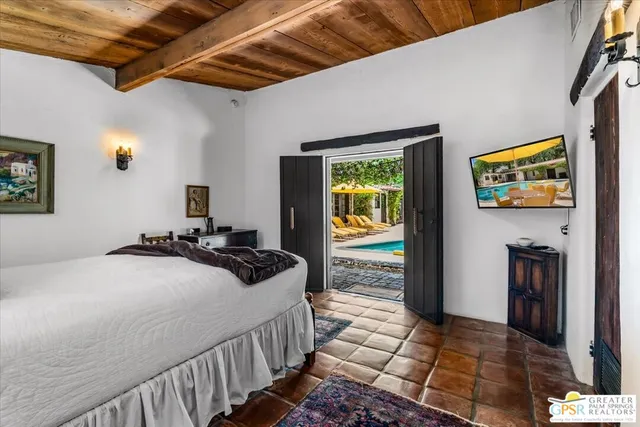 a bedroom with a bed and a view of bathroom