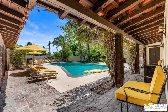 a view of a patio with a backyard