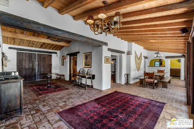 a living room with a large rug