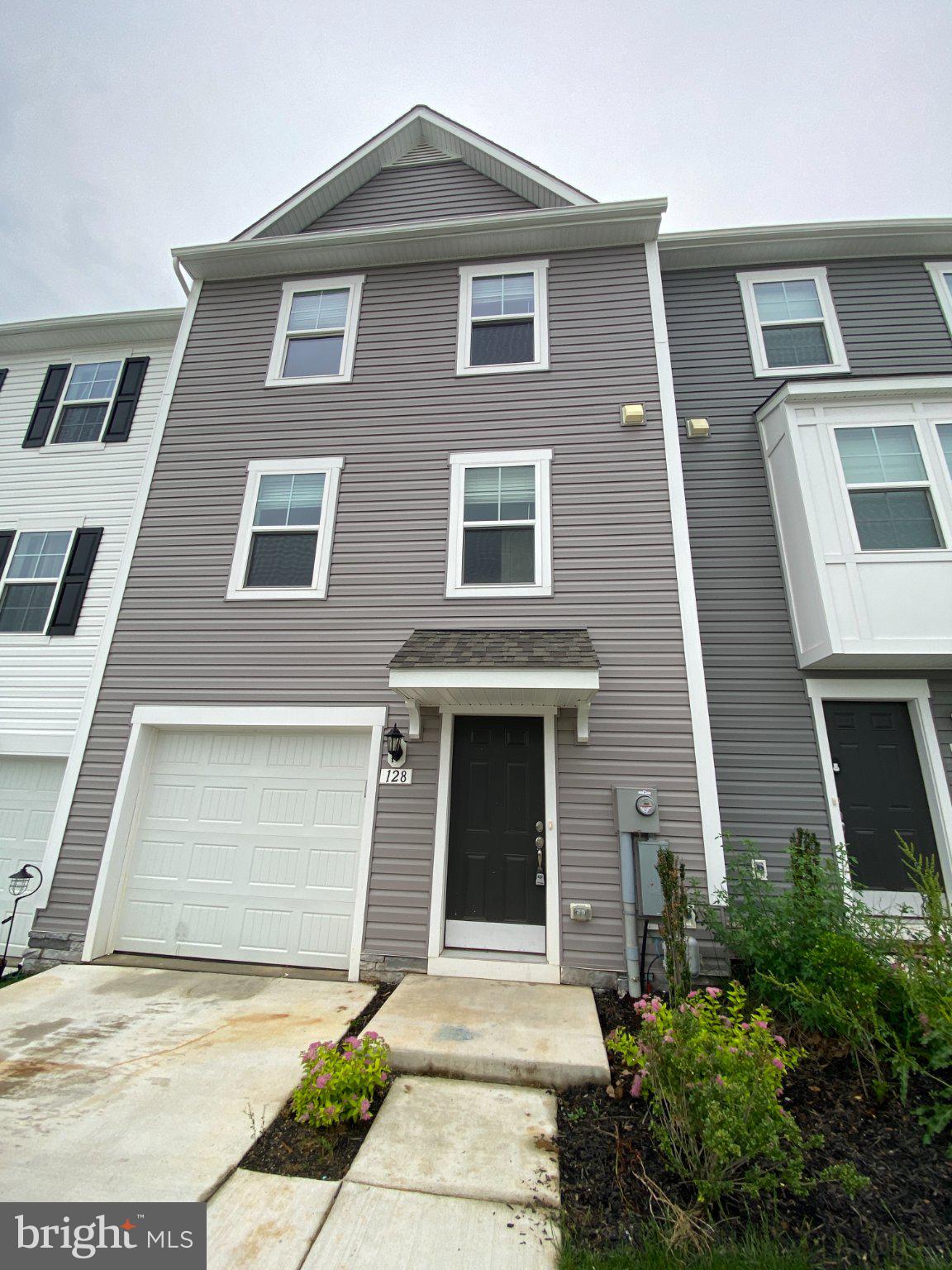 128 Tuxford Road Falling Waters, WV 25419 - Photo 3 of 27 Modern townhouse with inviting curb appeal.