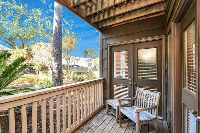 a view of balcony with wooden floor