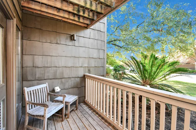a view of a chair and table in the balcony