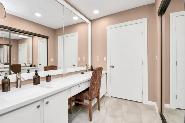 a view of bathroom with dual sinks