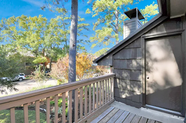 a view of balcony with wooden floor