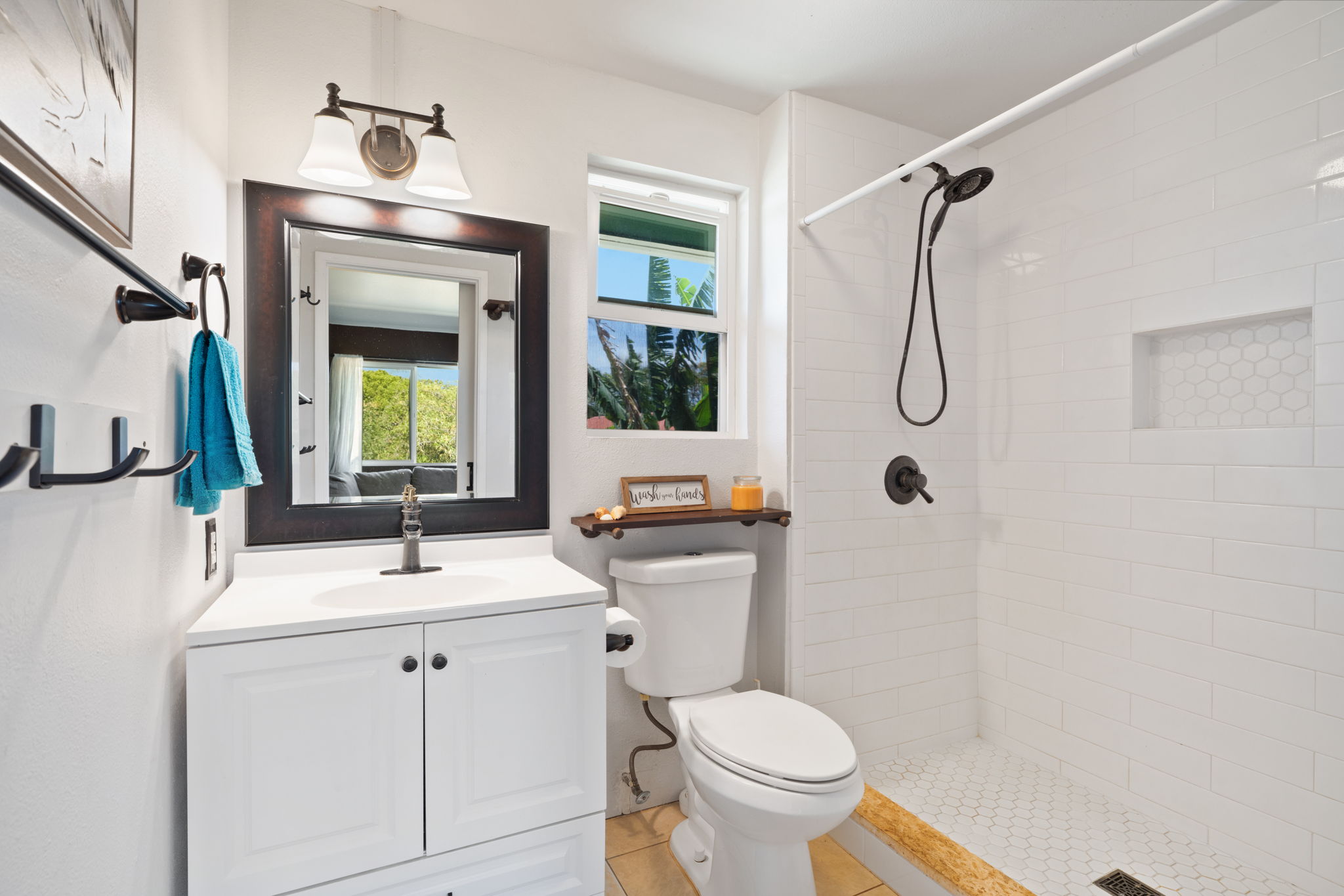 6100 Kawaihau Road Kapaa, HI 96746 - Photo 19 of 22 a bathroom with a sink toilet and shower
