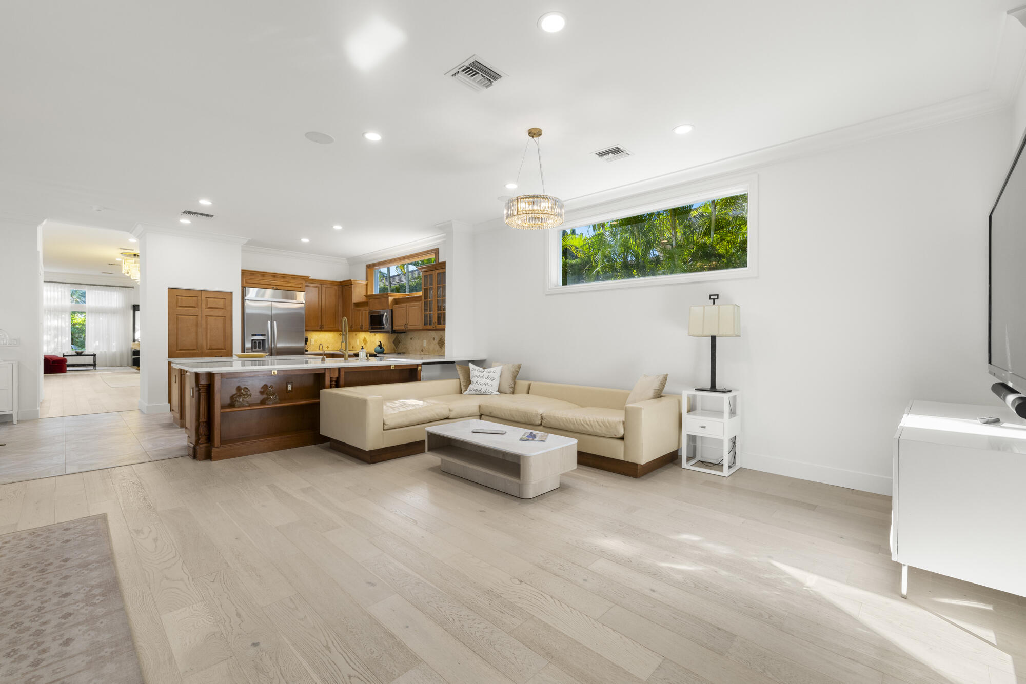 325 Eagle Drive Jupiter, FL 33477 - Photo 51 of 51 a living room with furniture and a flat screen tv