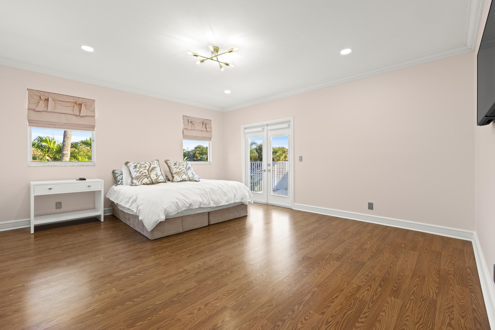 325 Eagle Drive Jupiter, FL 33477 - Photo 24 of 51 a bedroom with a bed and a window