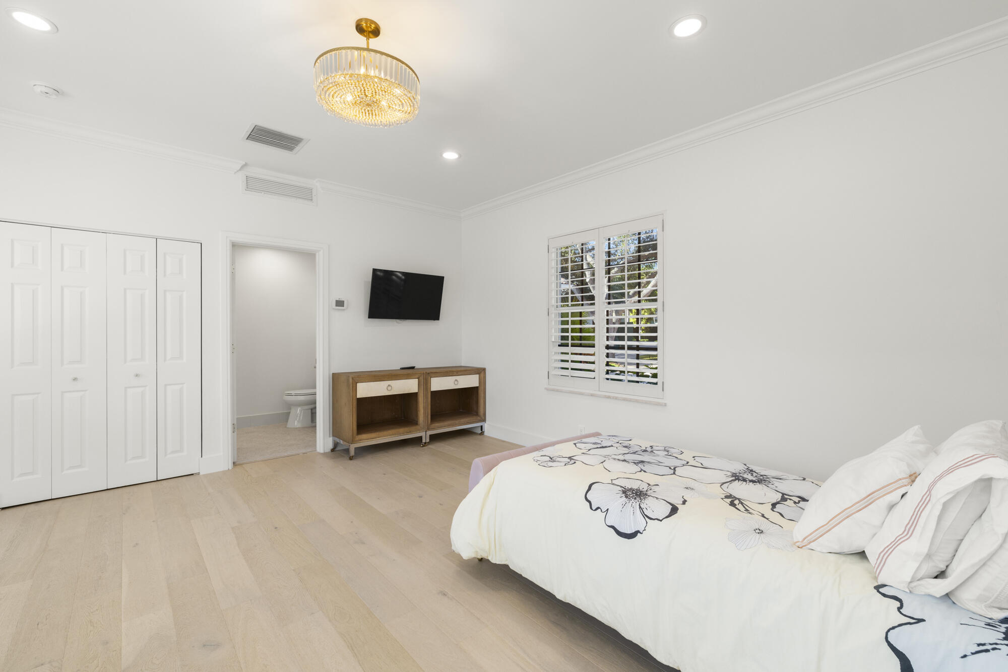 325 Eagle Drive Jupiter, FL 33477 - Photo 30 of 51 a bedroom with a bed and a window