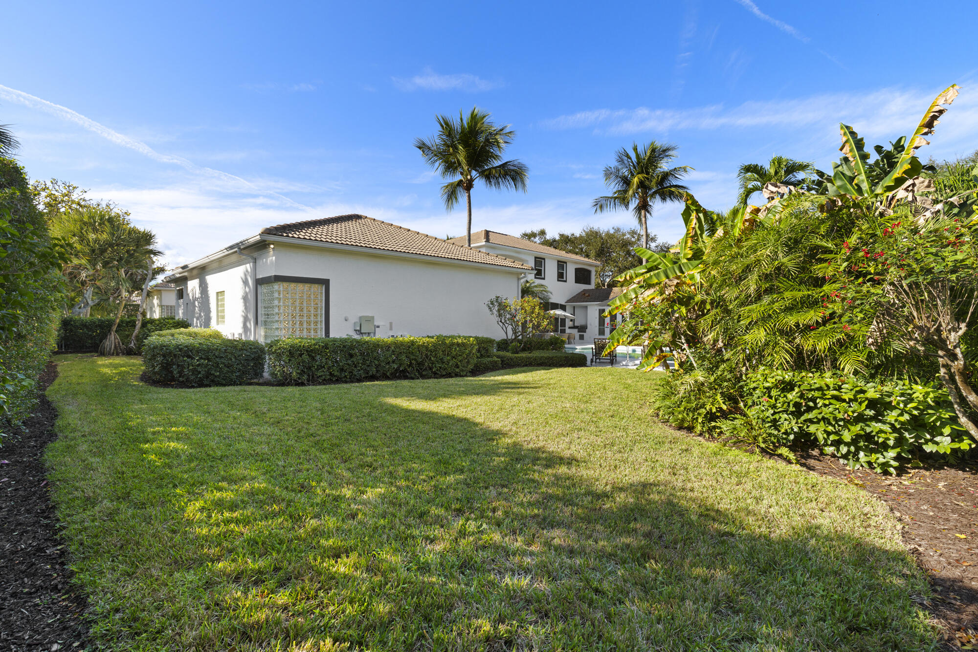 325 Eagle Drive Jupiter, FL 33477 - Photo 37 of 51 a view of a house with a yard