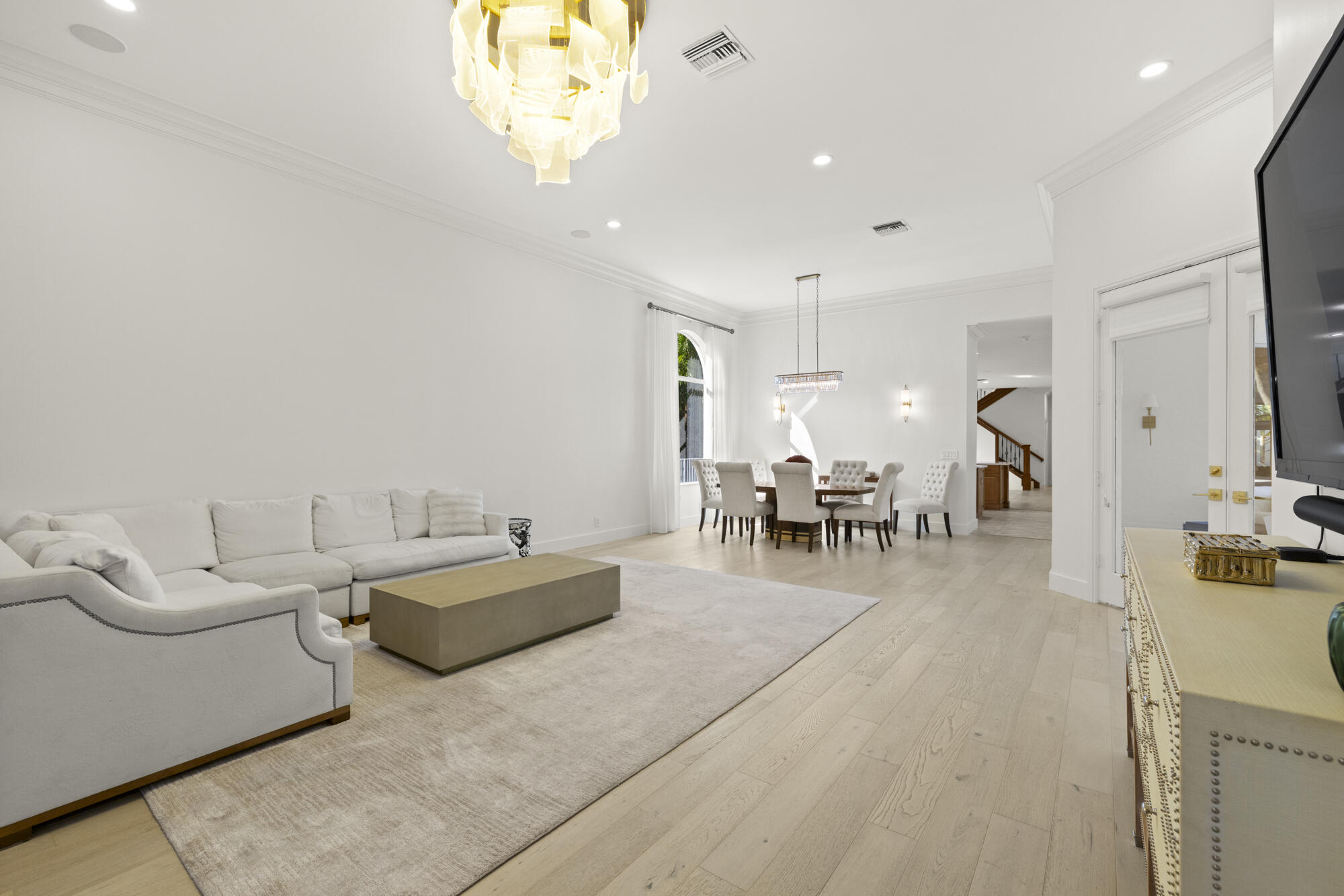 325 Eagle Drive Jupiter, FL 33477 - Photo 50 of 51 a living room with furniture and a table