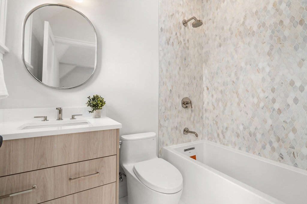 28 Parker Road Wellesley, MA 02482 - Photo 23 of 32 a bathroom with a sink toilet and shower