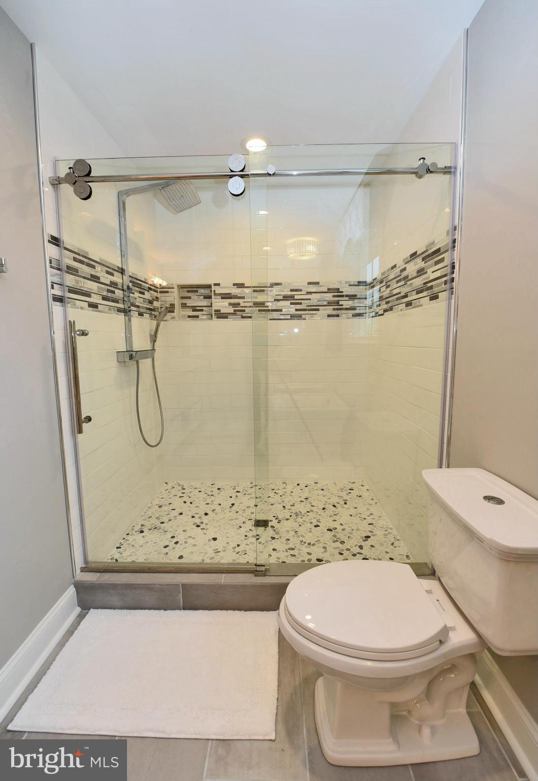 2012 High Point Road Forest Hill, MD 21050 - Photo 20 of 30 14" rain shower w/sprayer, River Rock floor.