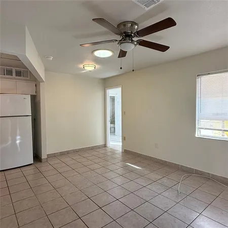 a view of an empty room and window