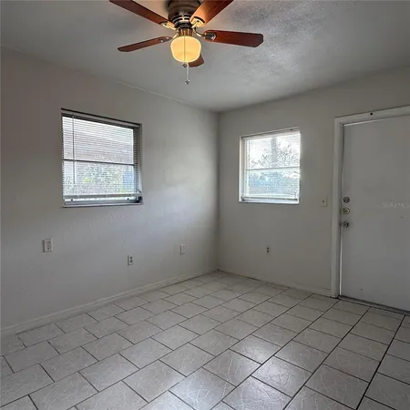 a view of an empty room with a window