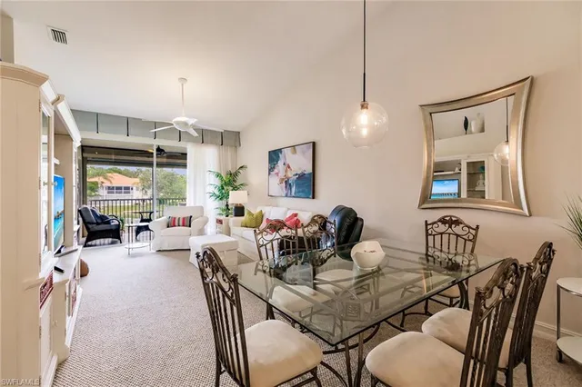 a view of a dining room with furniture window and outside view