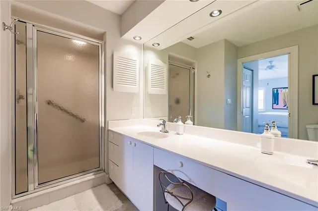 a bedroom with a bed a desk and chair