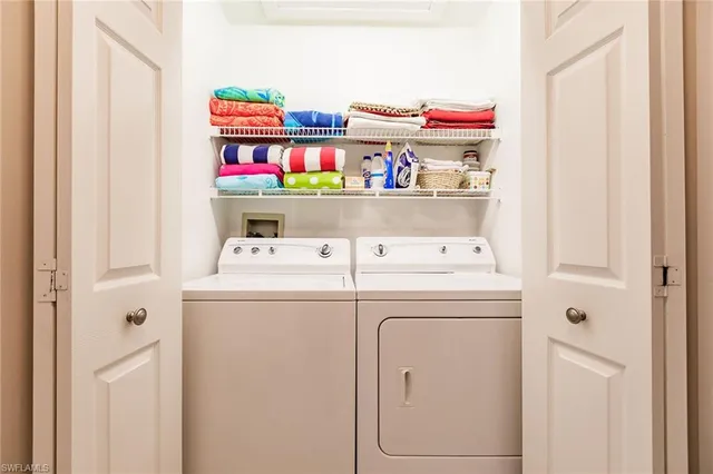 a living room with furniture floor to ceiling window and a clock