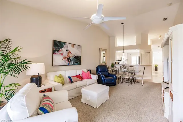 a kitchen with a refrigerator and a stove top oven