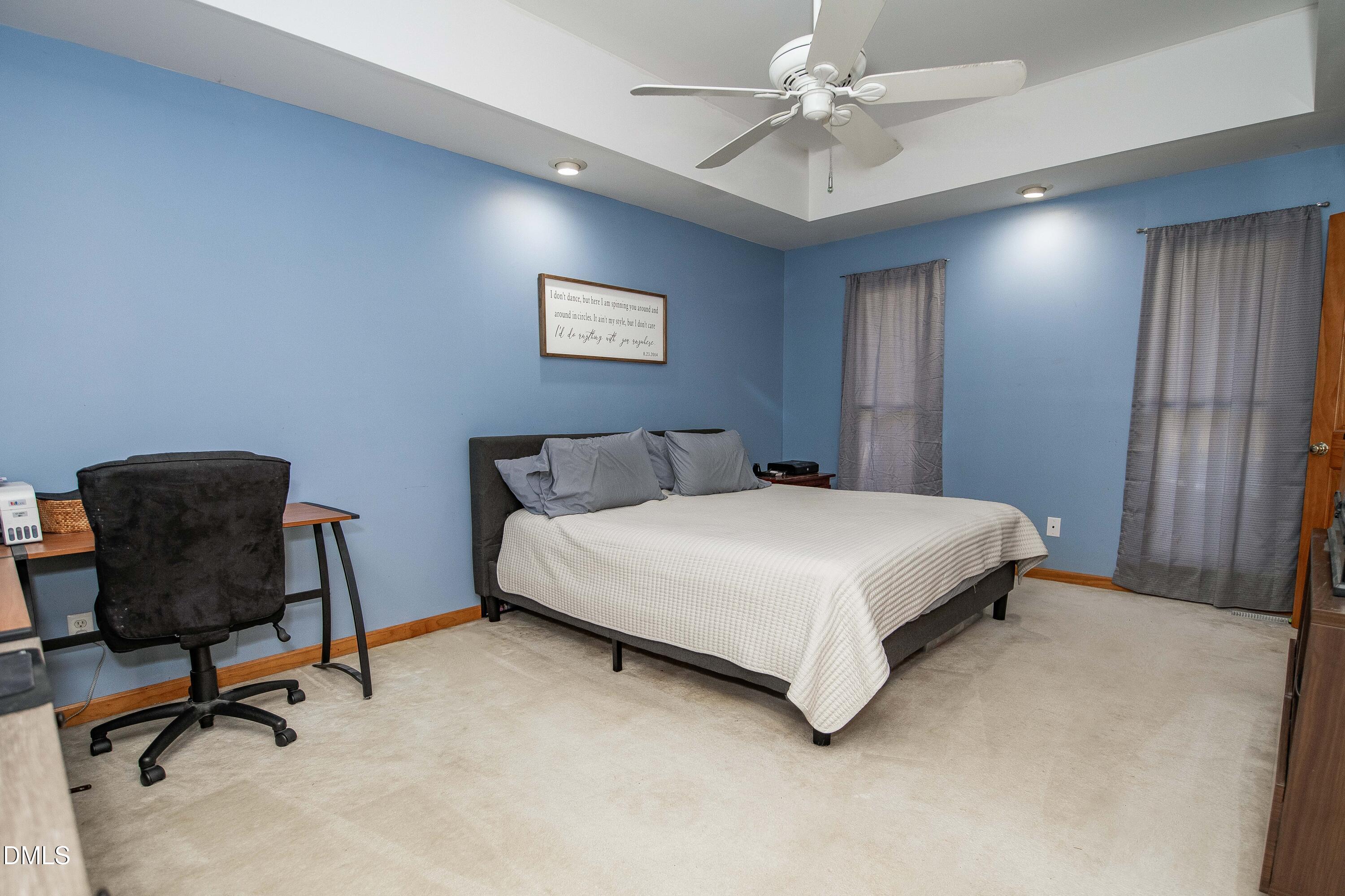 123 Chris Court Garner, NC 27529 - Photo 15 of 24 a bedroom with a bed chair and window