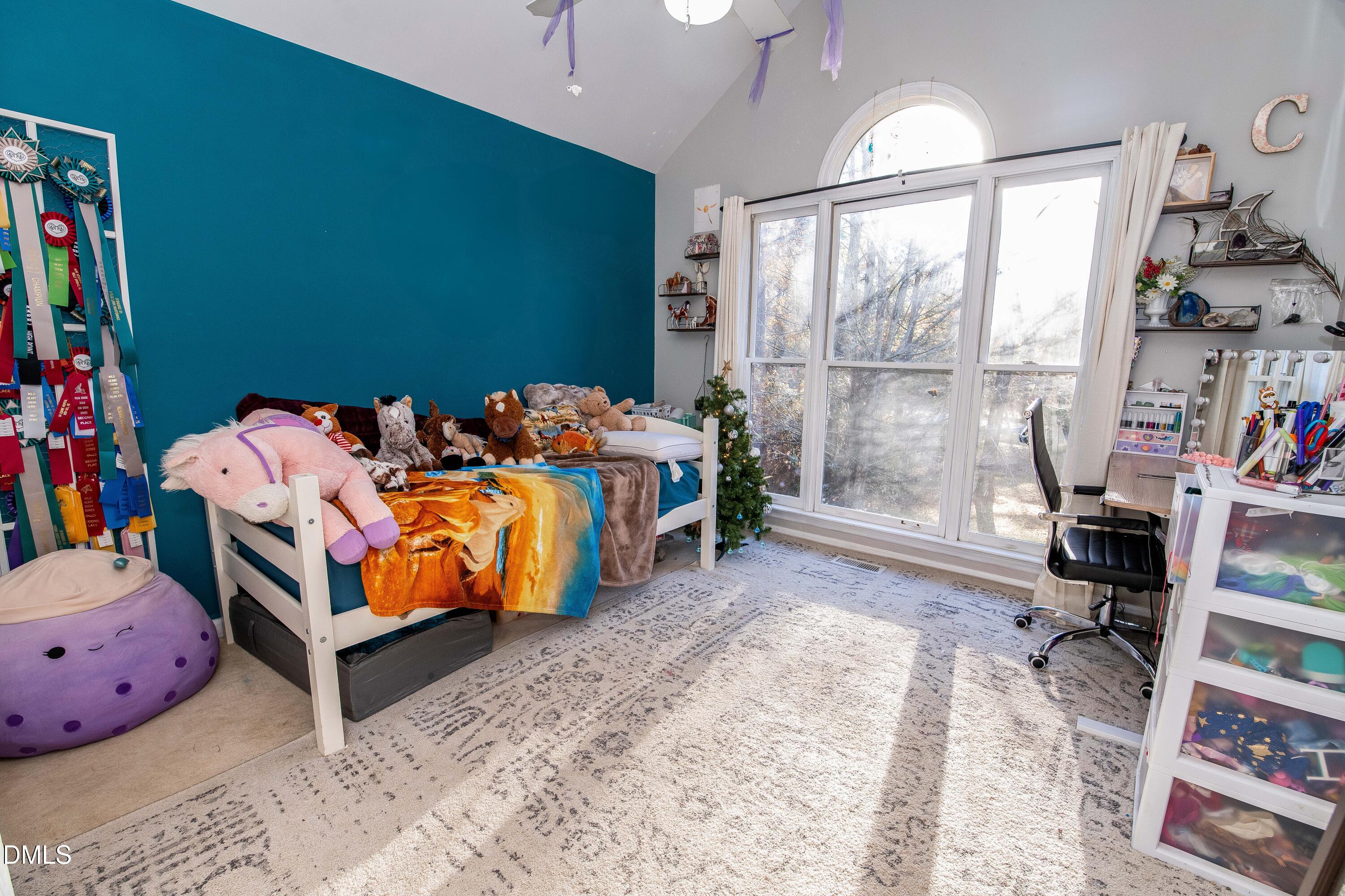 123 Chris Court Garner, NC 27529 - Photo 19 of 24 a bed room with a bed and a chair