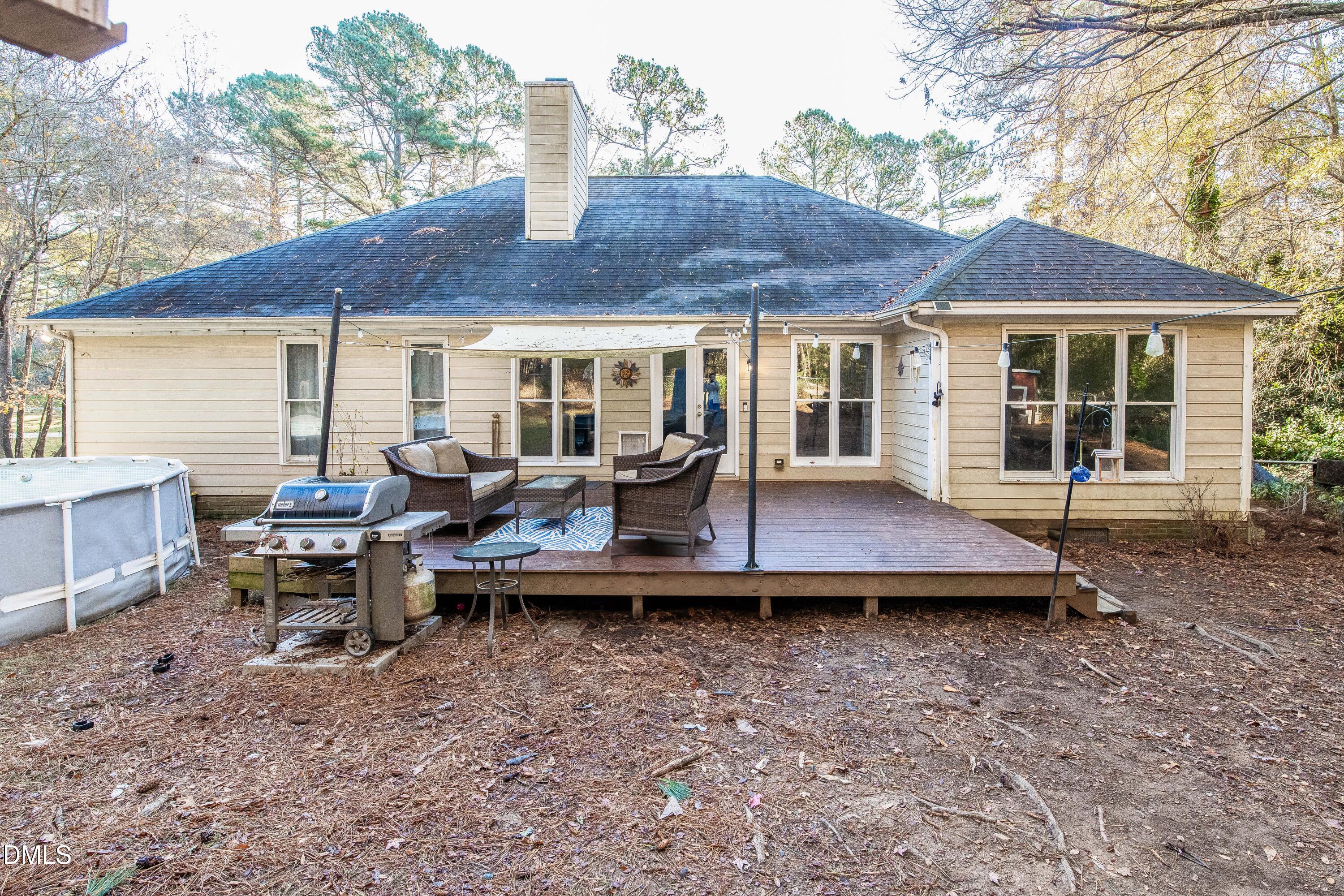 123 Chris Court Garner, NC 27529 - Photo 21 of 24 a view of a house with backyard and sitting area
