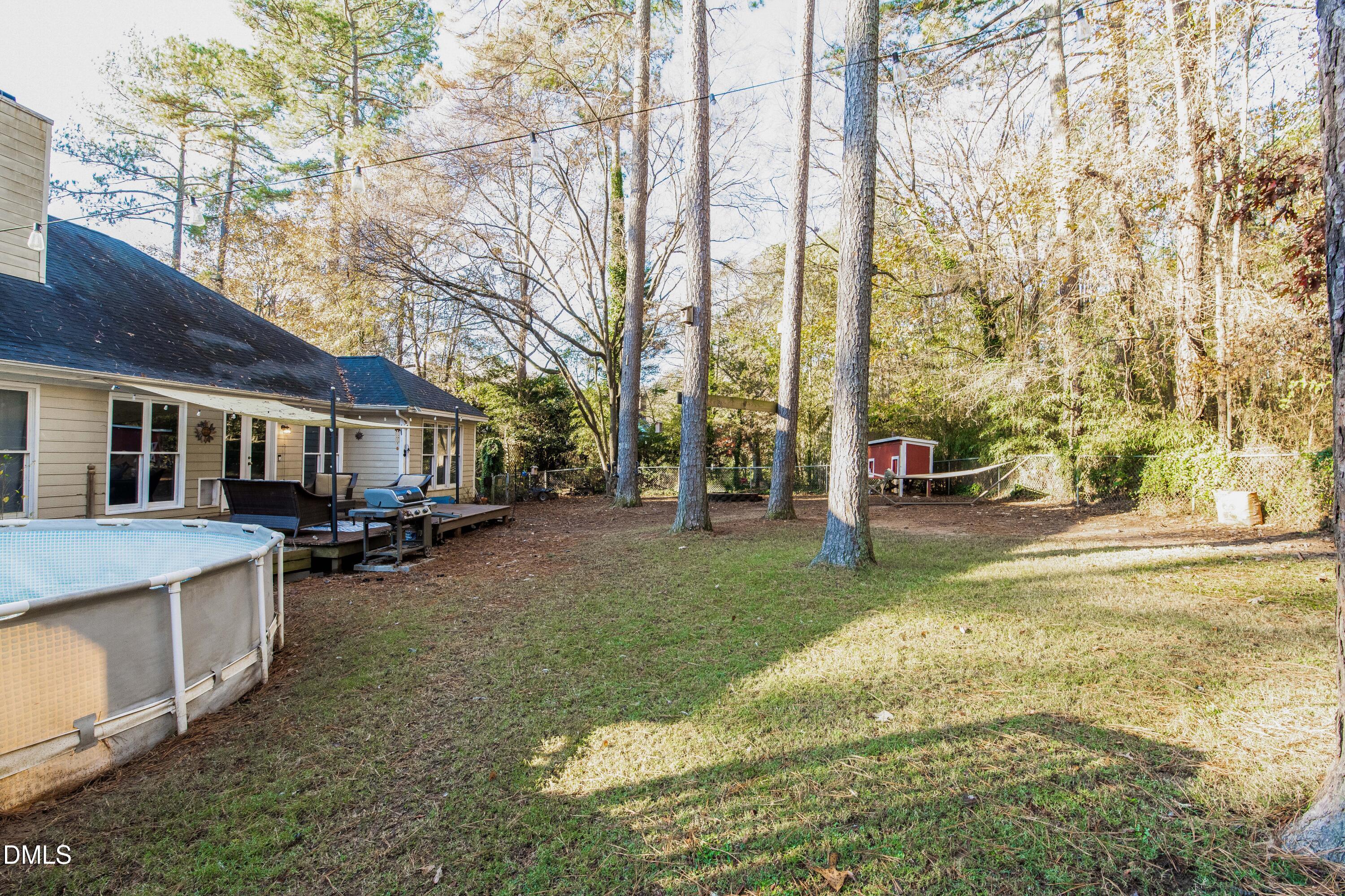 123 Chris Court Garner, NC 27529 - Photo 23 of 24 a view of a house with backyard and sitting area